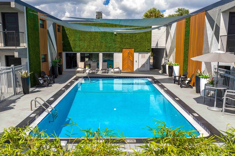 Experience a refreshing retreat at our beautifully designed pool area. Featuring sleek design, comfortable lounge seating, and vibrant landscaping, it's your go-to spot for unwinding or soaking in the Florida sun.