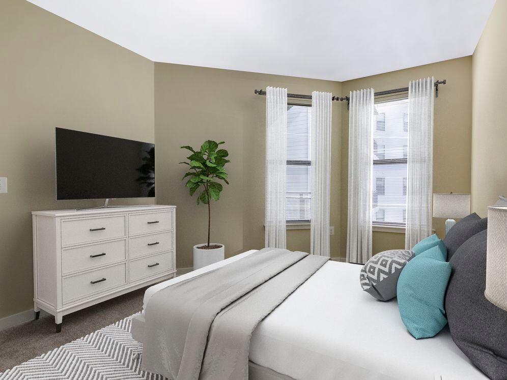 Upgraded bedroom with carpet