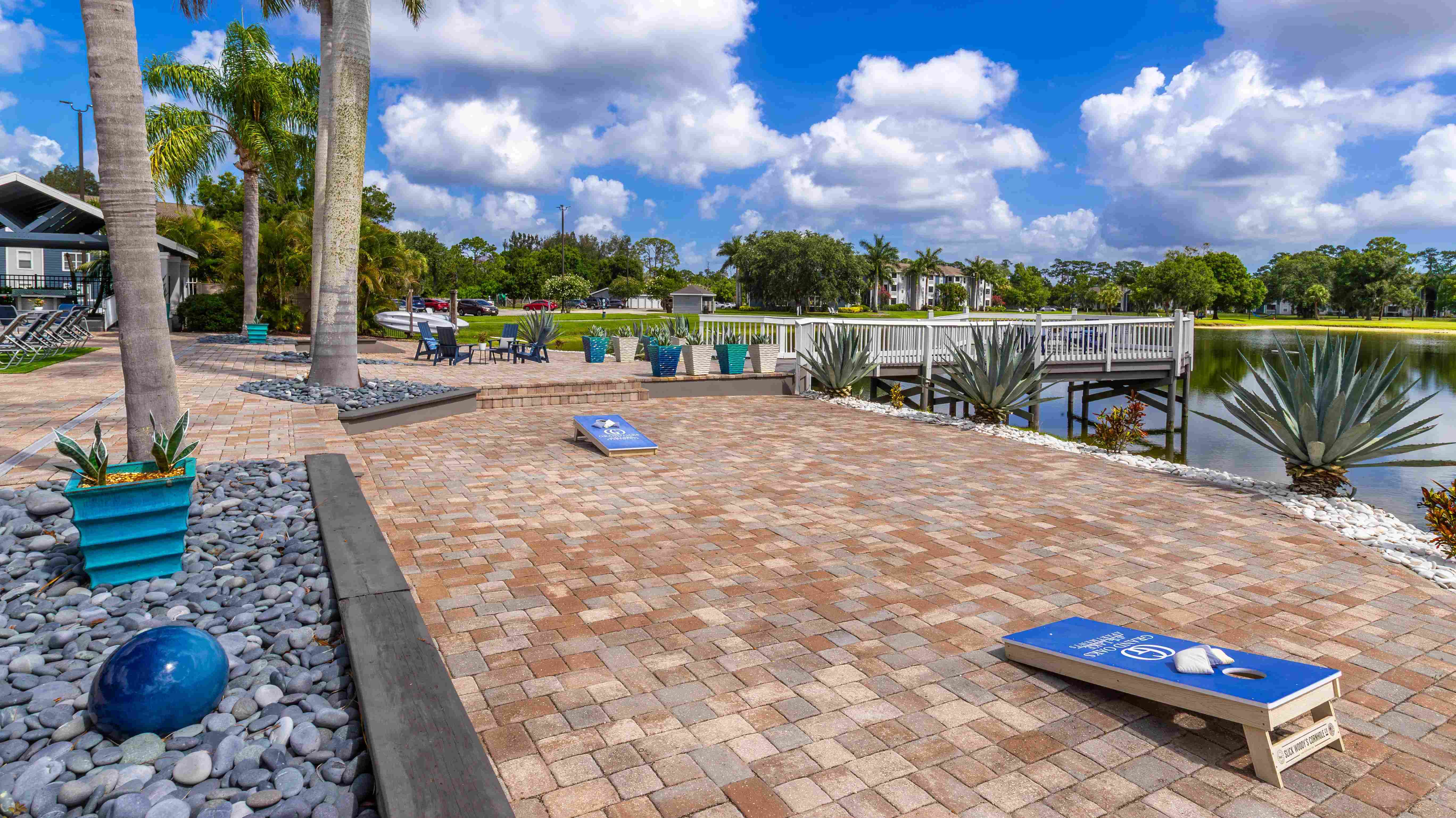 Enjoy a friendly game of cornhole on our scenic lakefront patio, surrounded by tropical landscaping and just steps from our relaxing outdoor seating.