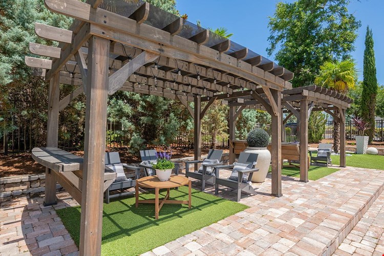 Relax in our comfortable seating under our poolside pergolas.