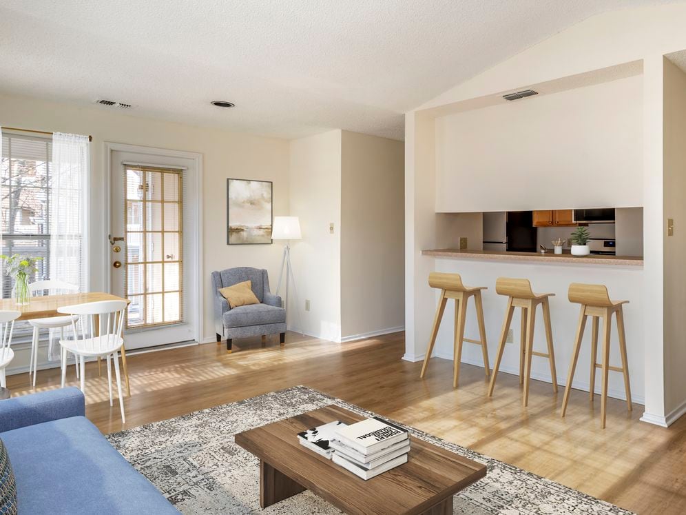 Renovated Package I kitchen and living area with hard surface flooring in common areas