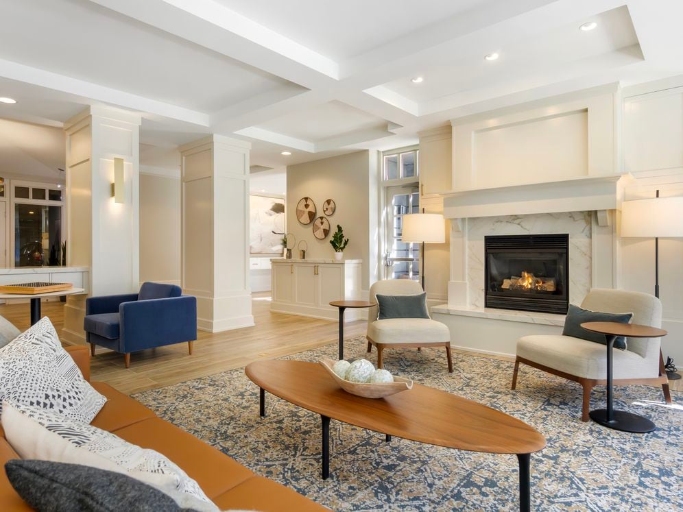 Resident lounge with seating area and fireplace