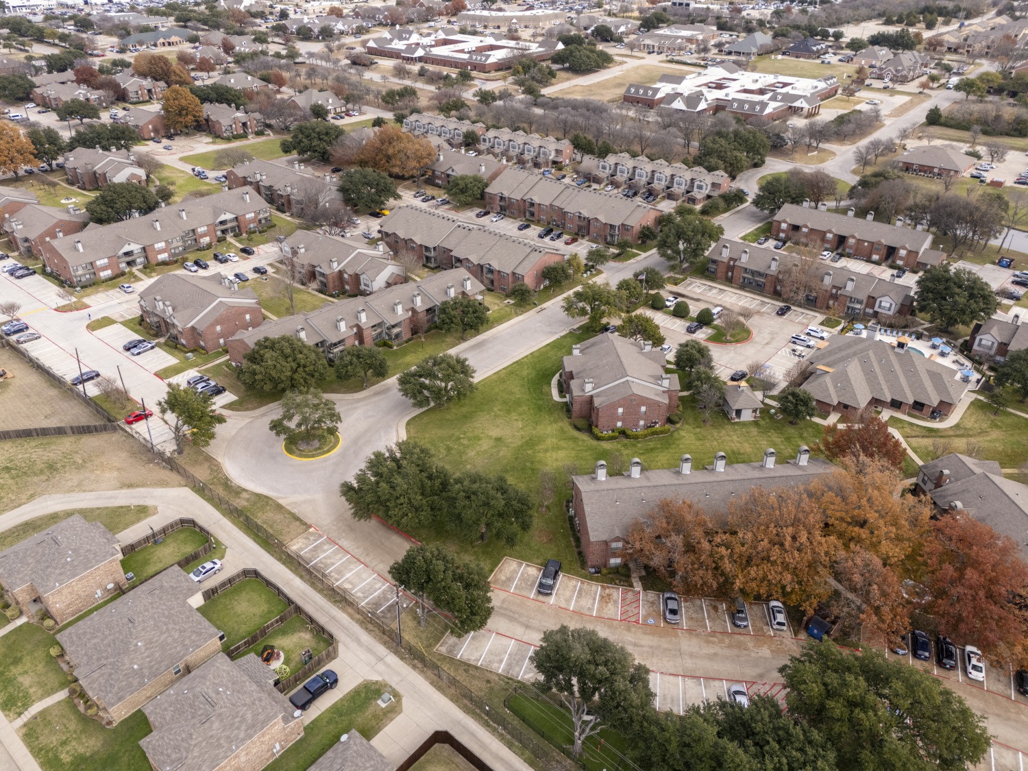 An aerial view of a neighborhood of houses in a suburb