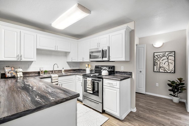 Large, open kitchen with new stainless steel appliances and ample amounts of storage space. We are excited to offer in-person tours while following social distancing and we encourage all visitors to wear a face covering.