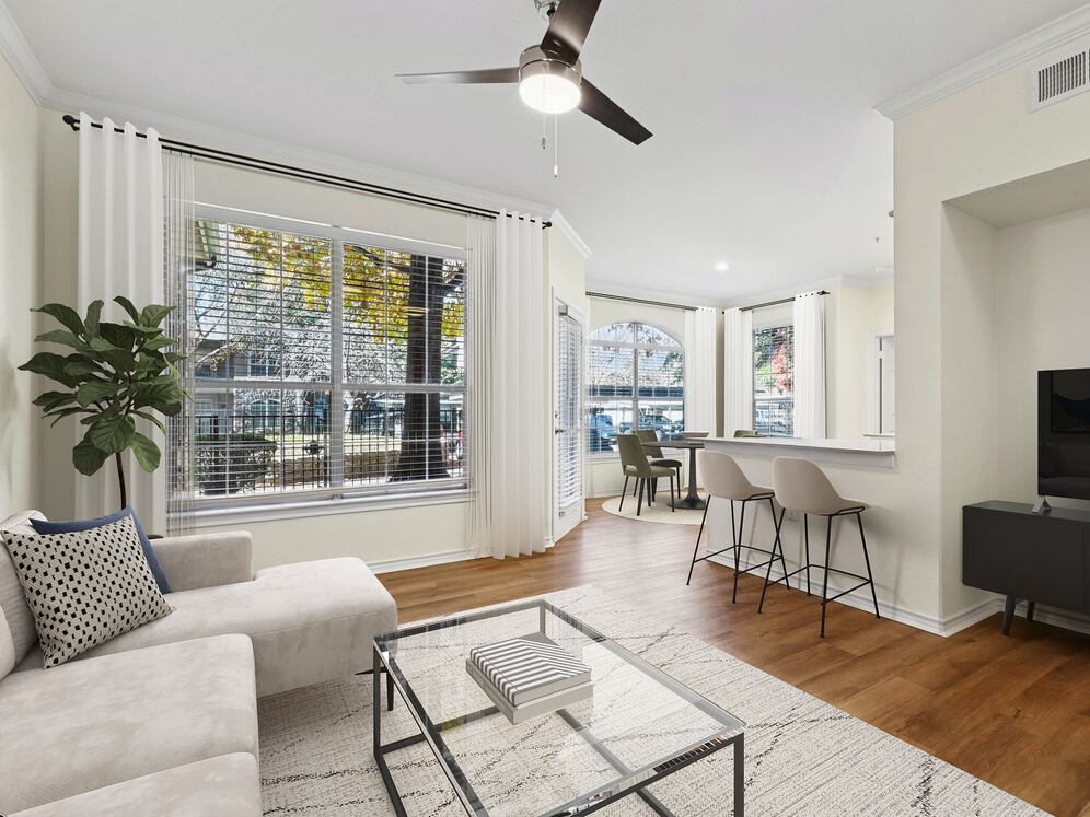 Renovated Package I living room with hard surface flooring
