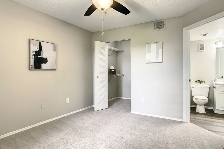 Delight your roommate or family member the gift of their own walk-in closet and ensuite bathroom in this guest bedroom ensemble.