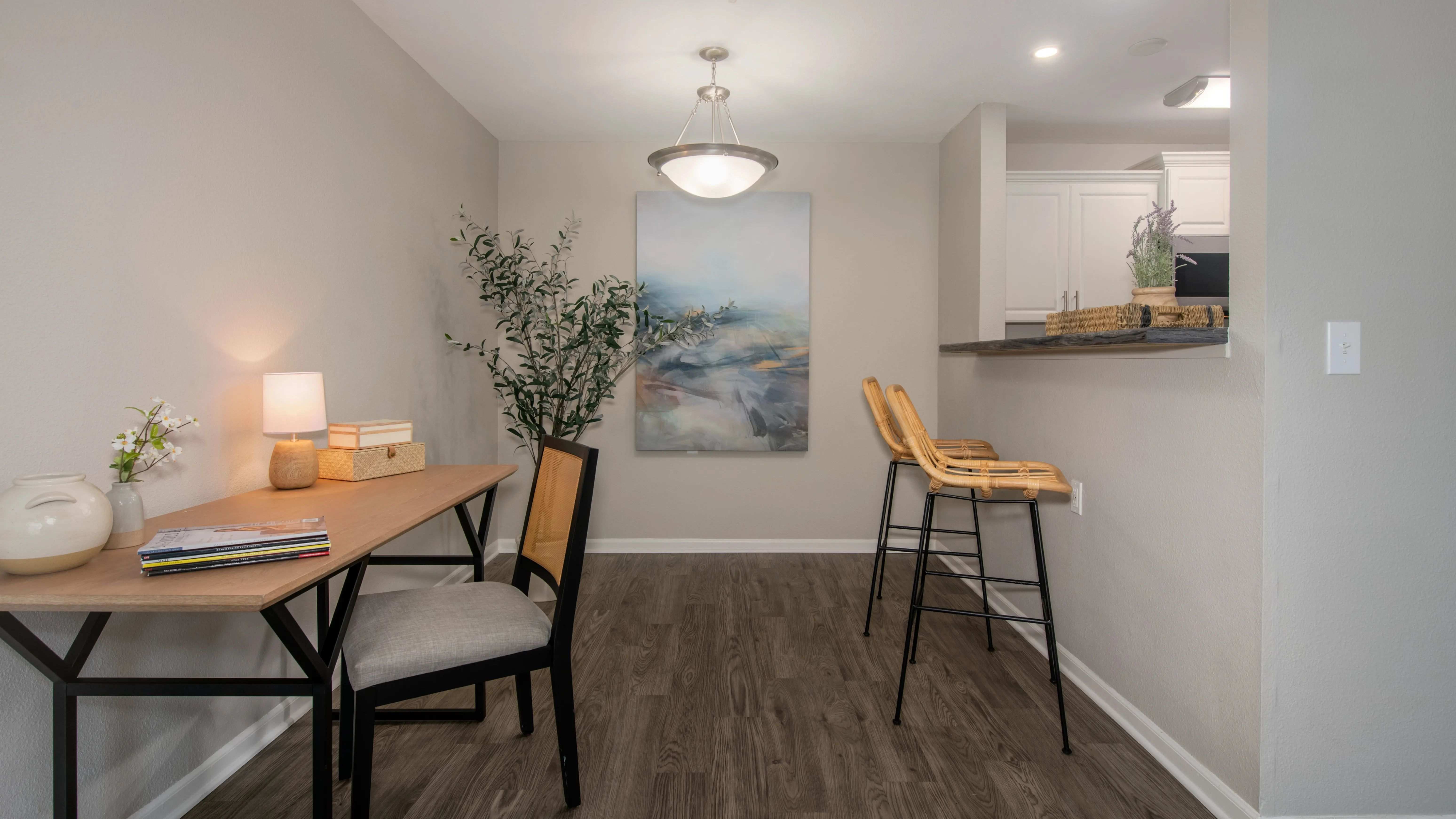 Our one-bedroom floor plan offers a dedicated office workspace, featuring sleek wood-like floors and ample space for productivity. 