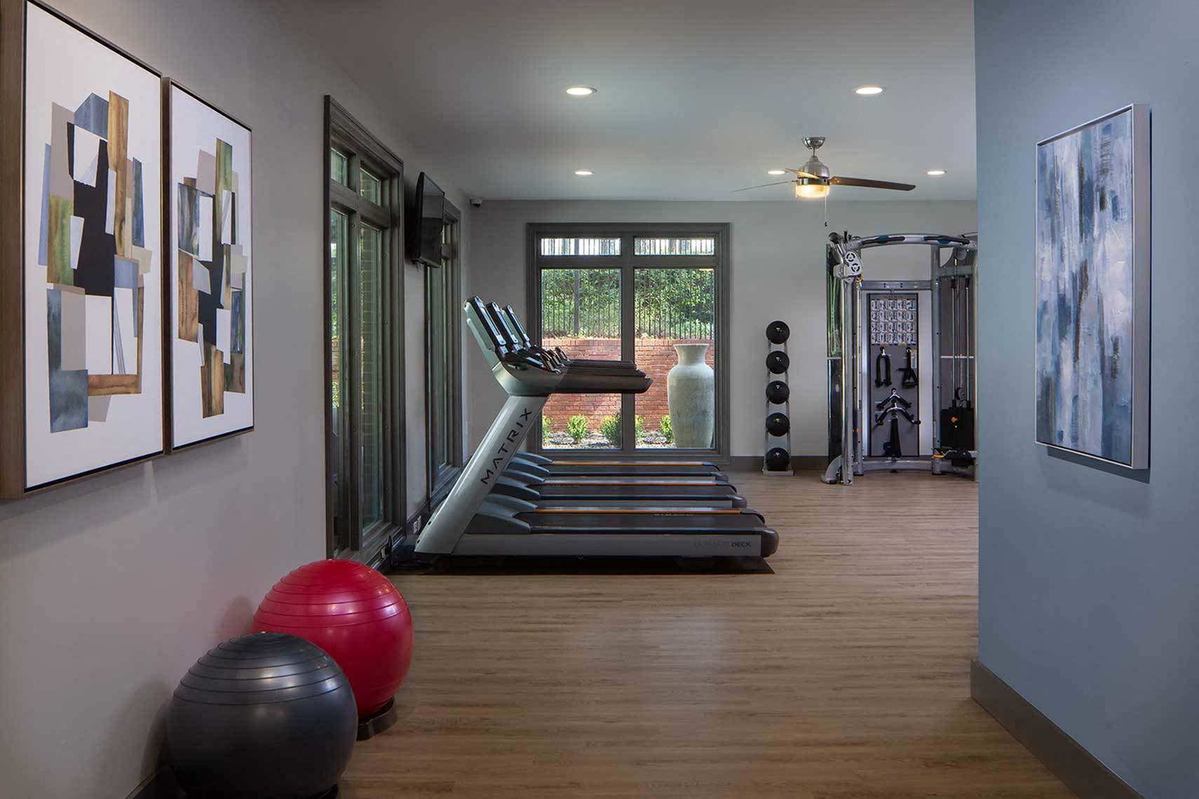 Fitness Center with Treadmills, strength training and large windows