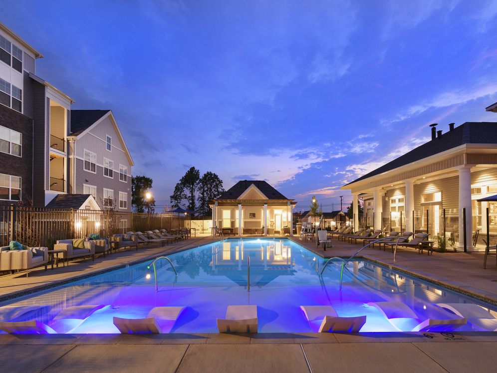 Swimming pool and sundeck with lounge seating