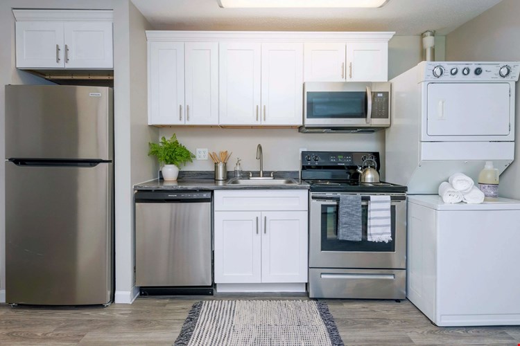 Discover the perfect kitchen with abundant cabinetry and storage as well as an in-unit washer & dryer for effortless living.