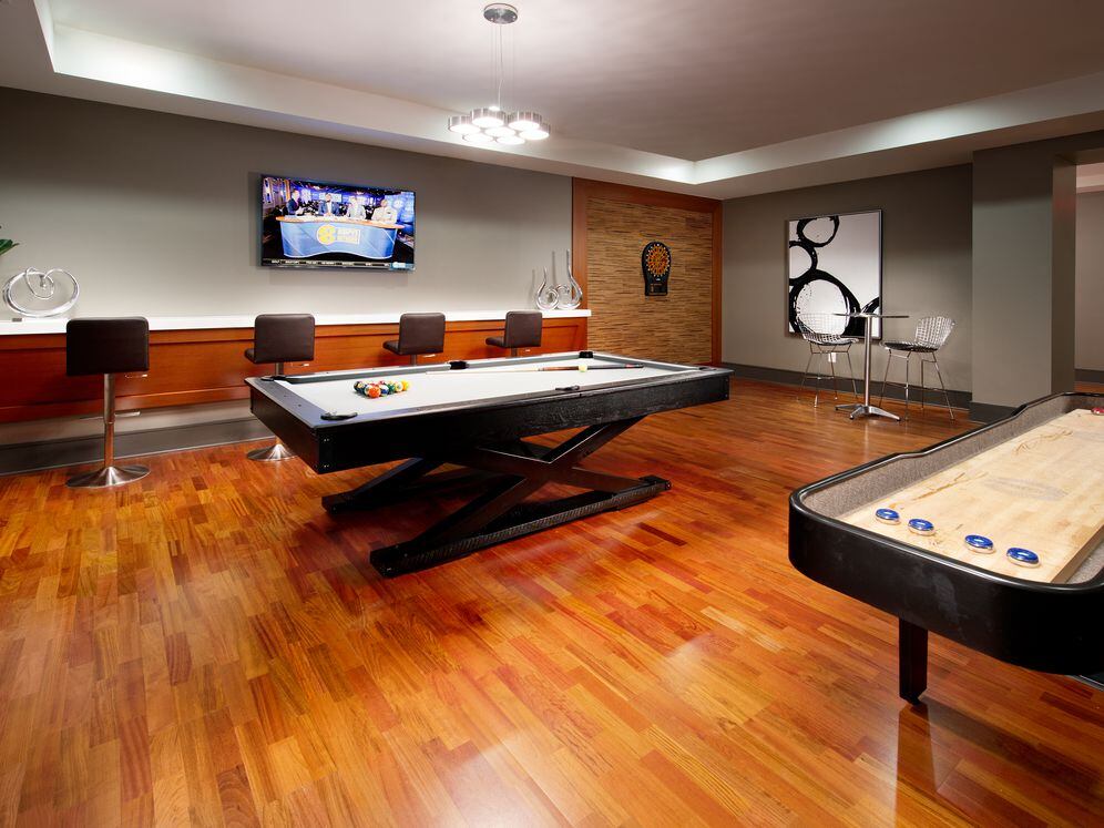 Resident lounge game room with billiards, shuffleboard and flat screen TV