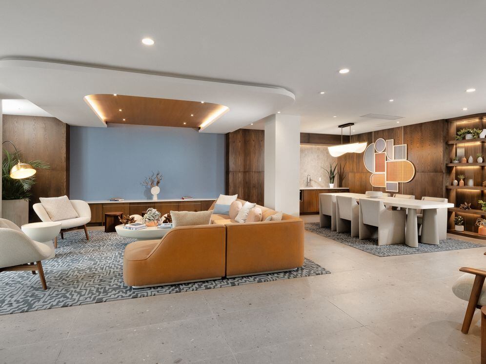 Lounge with kitchenette and seating areas