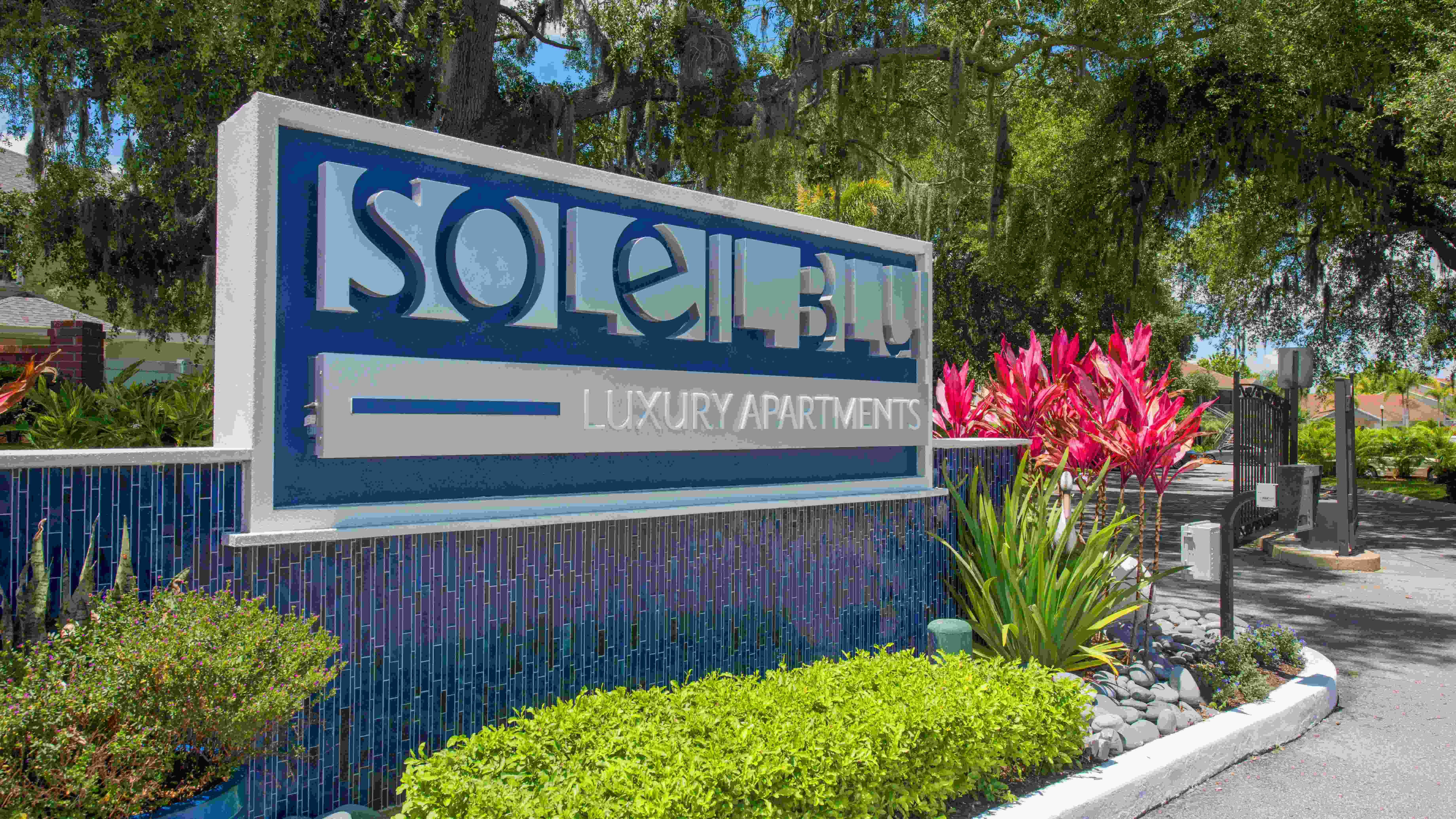 Discover luxury living at Soleil Blu Apartments in St Cloud, FL. Our beautifully landscaped community entrance features a striking modern sign that invites you to experience the comfort and style of resort-style living.