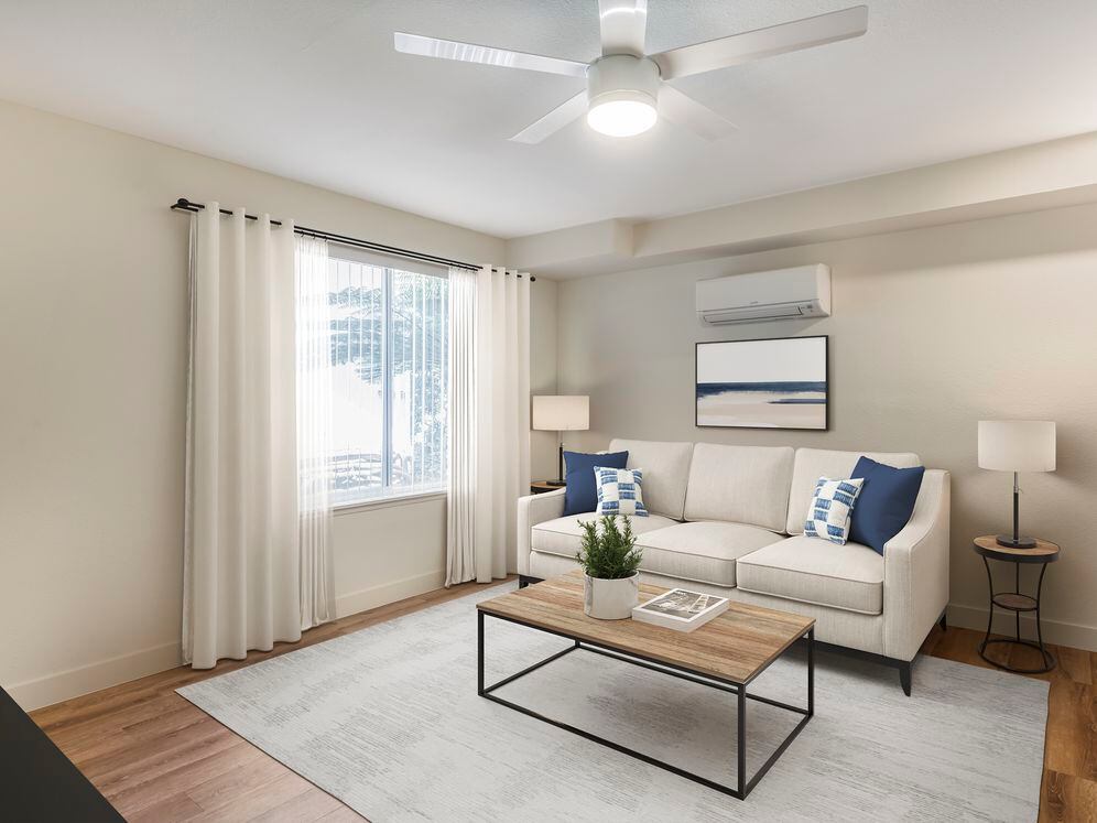 Renovated Package II living room with hard surface flooring