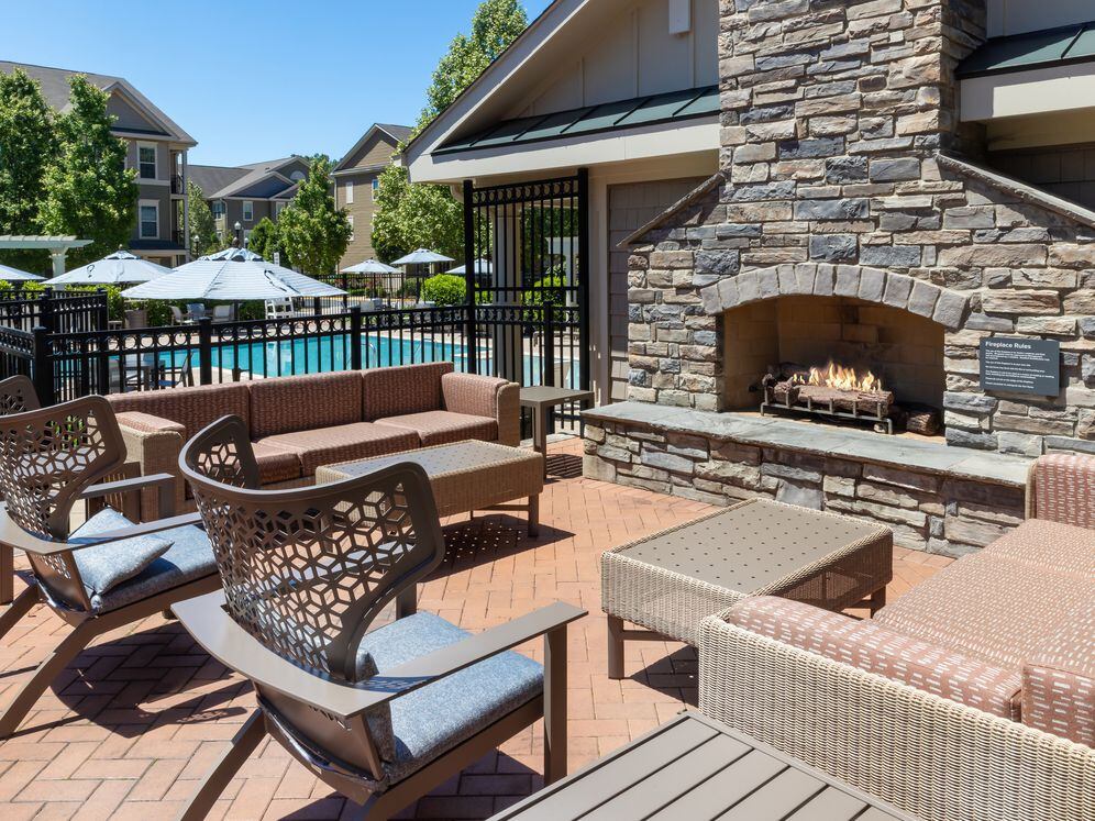 Courtyard with lounge seating and a fireplace