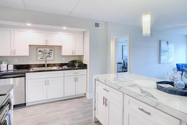 Kitchens feature ample cabinetry.