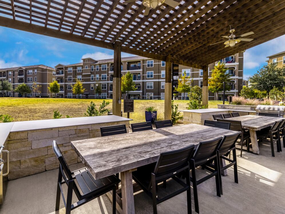 Courtyard with grill stations and dining areas