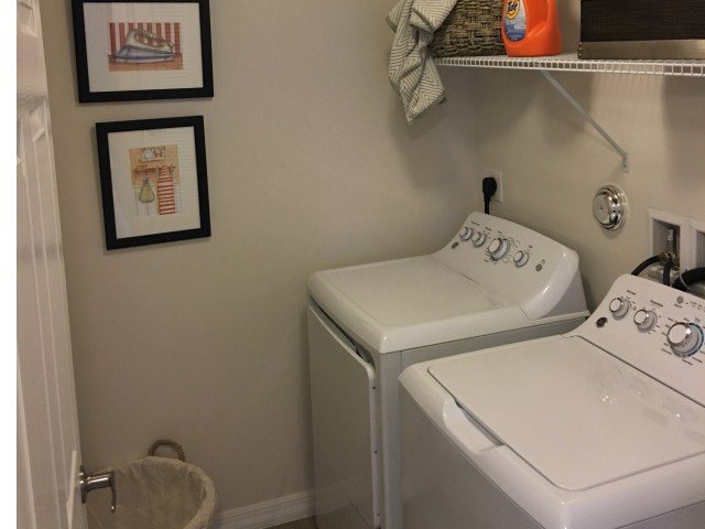 Laundry room of the one bedroom floorplan.