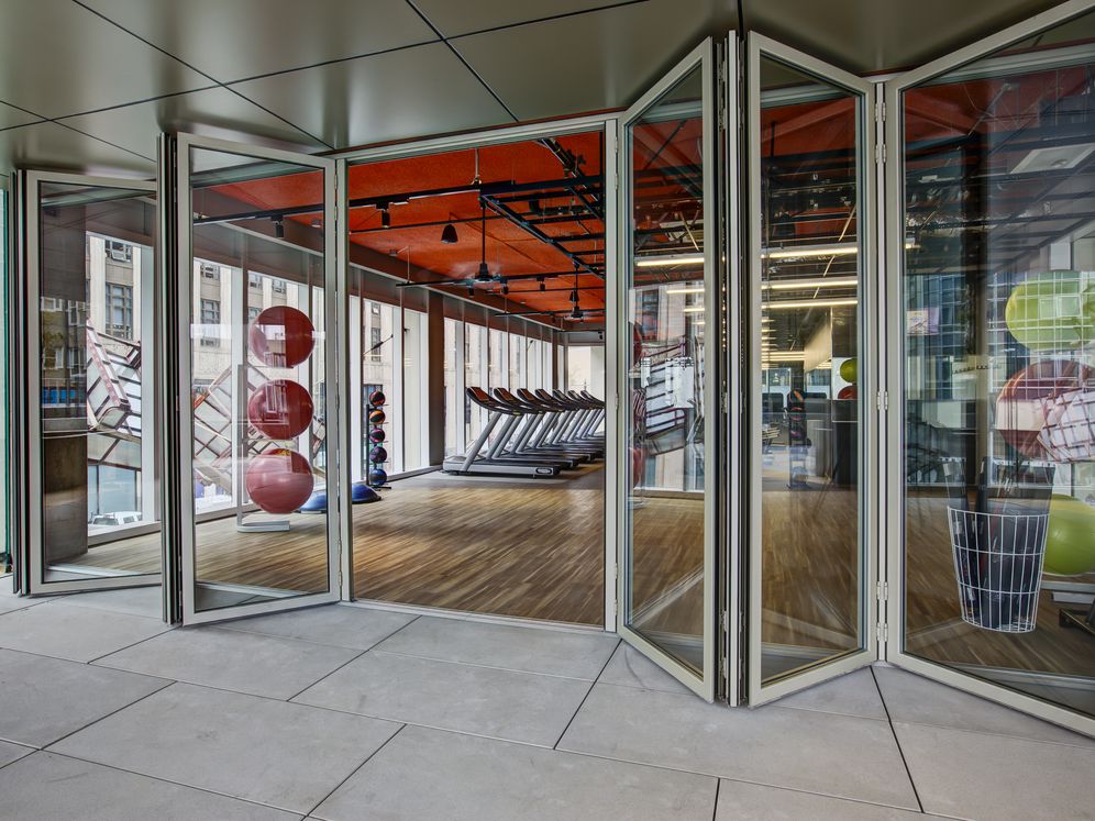 Fitness center with cardio equipment and stretching area