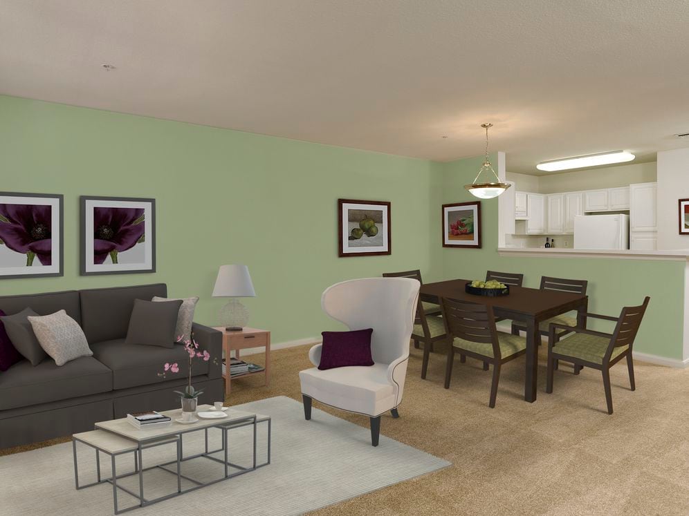 Classic Package kitchen, living, and dining area with white cabinetry, light laminate countertops, white appliances, and vinyl tile flooring with carpeting in common areas