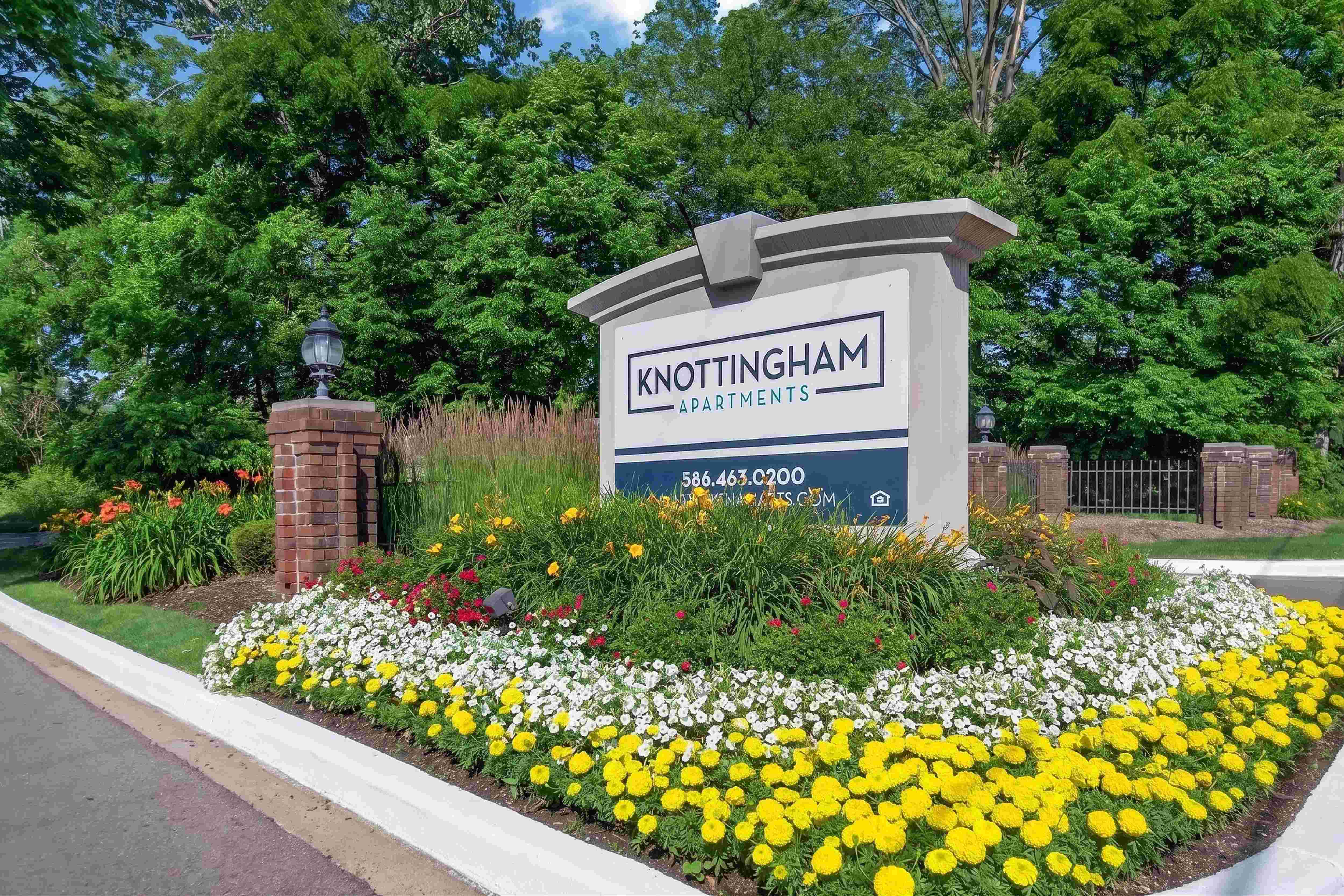 Welcoming entrance at Knottingham Apartments in Clinton Township, MI.