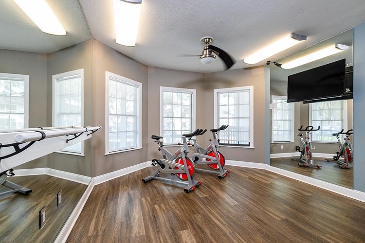 Embrace rejuvenation and find your inner balance at Carrington Lane Apartments' Spin and Yoga Studio.