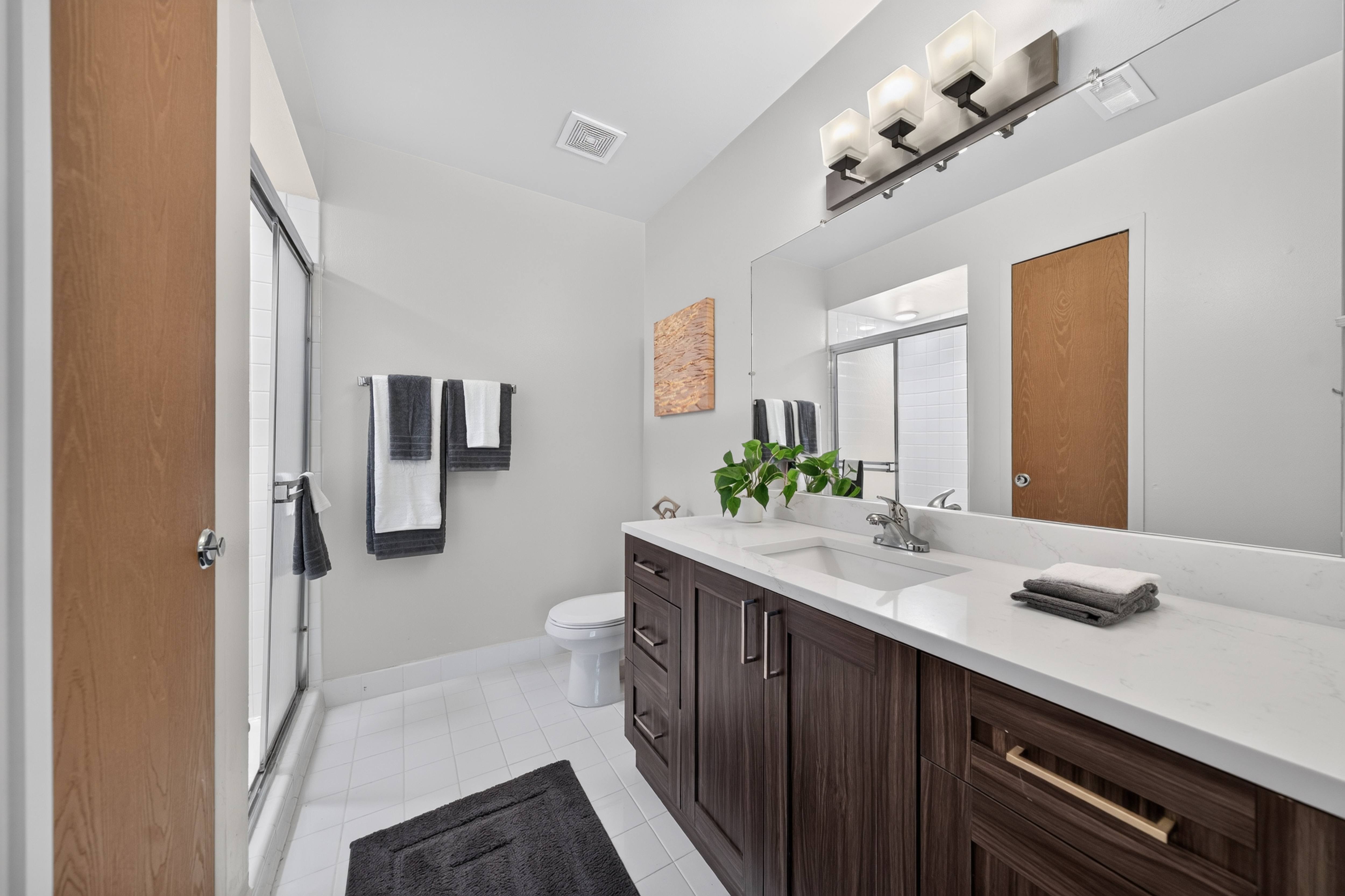 Bathroom with ample storage at Franklin River in Southfield, MI.
