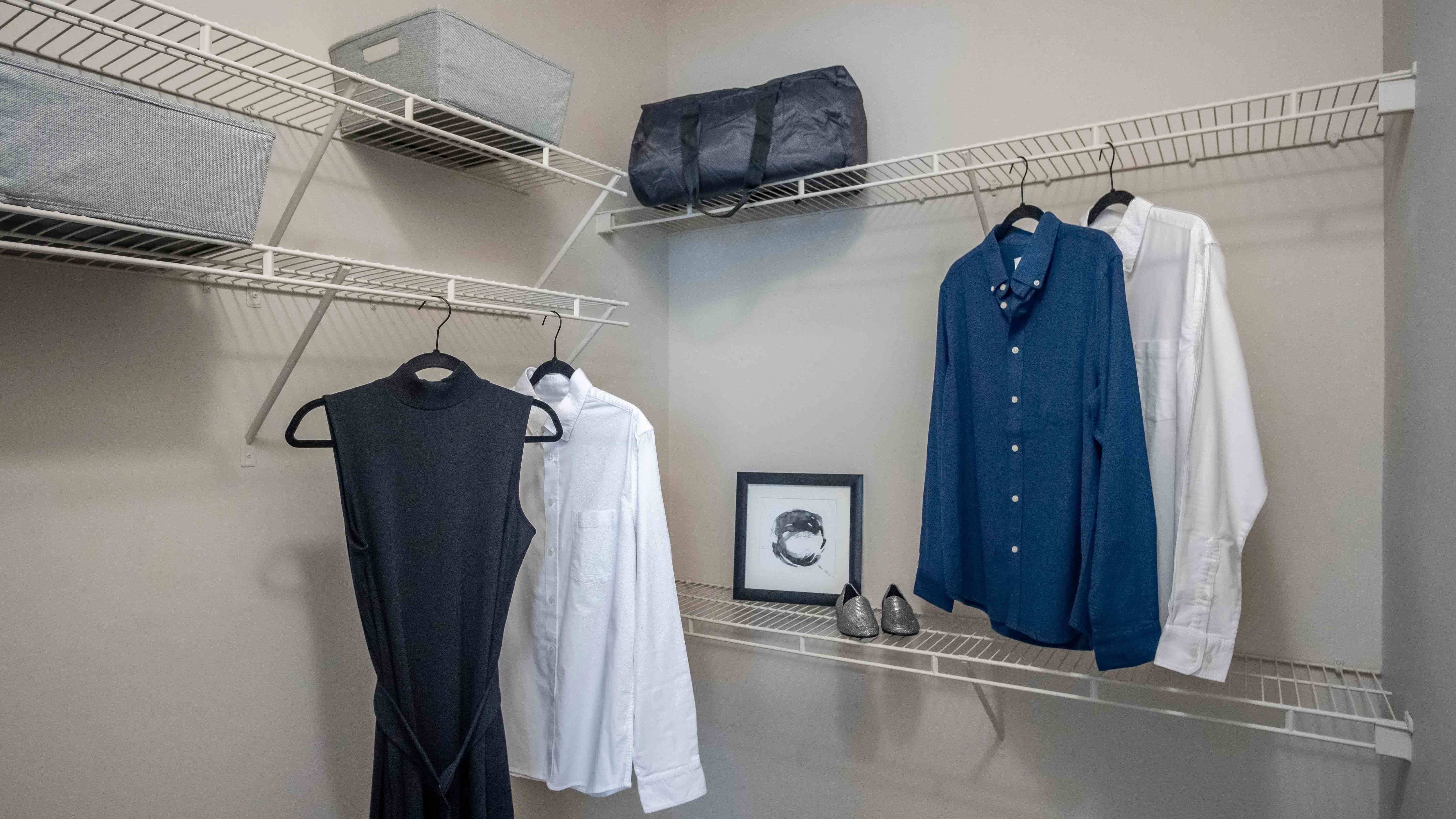 Experience unmatched organization and style in the master bedroom's walk-in closet with staggered shelving.