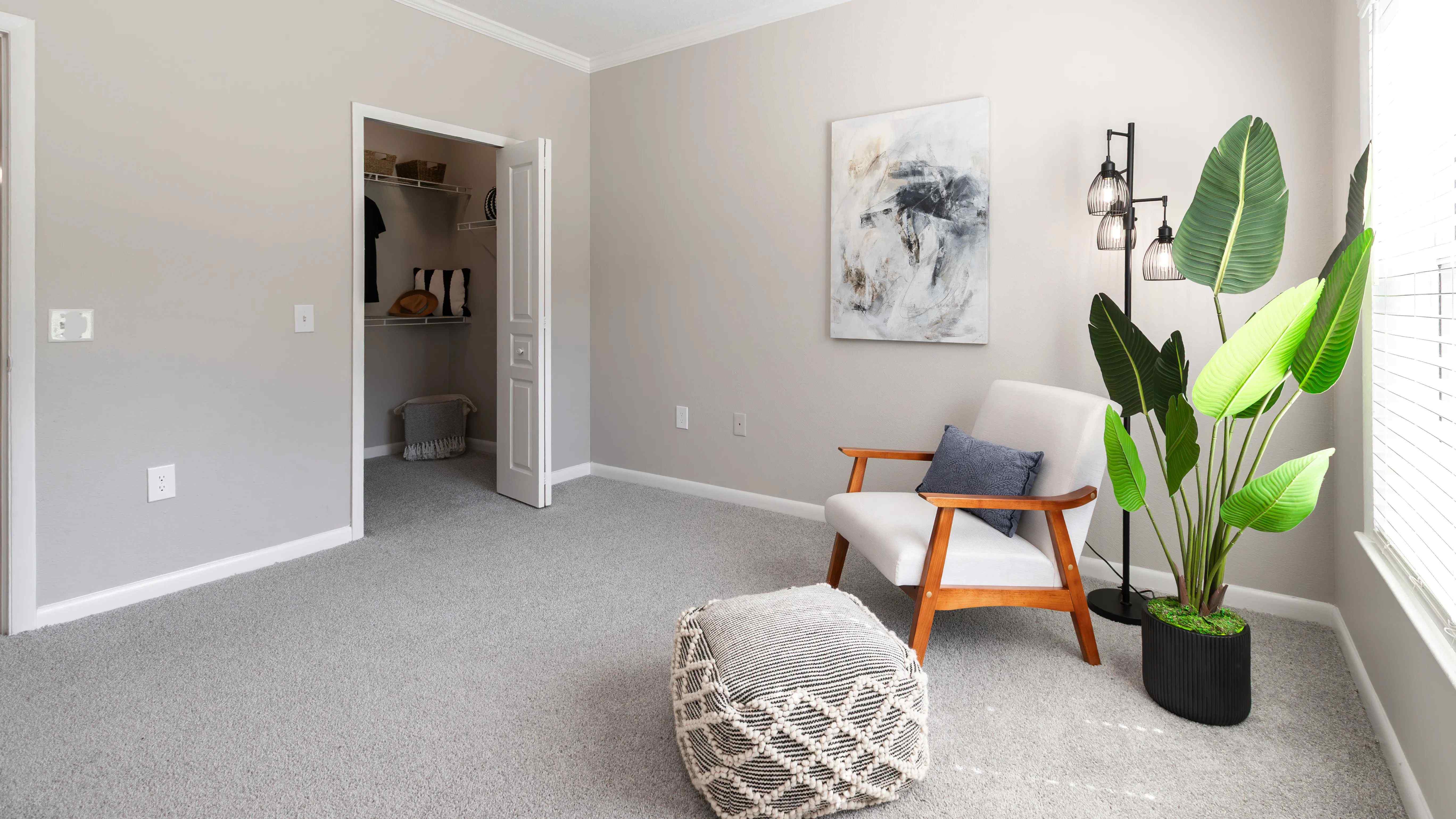 A blend of comfort and convenience, this bedroom features serene design elements, abundant natural light, and a walk-in closet with built-in storage.