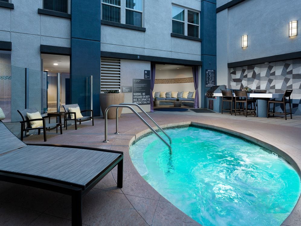 Spa and grill area with cabana and outdoor seating