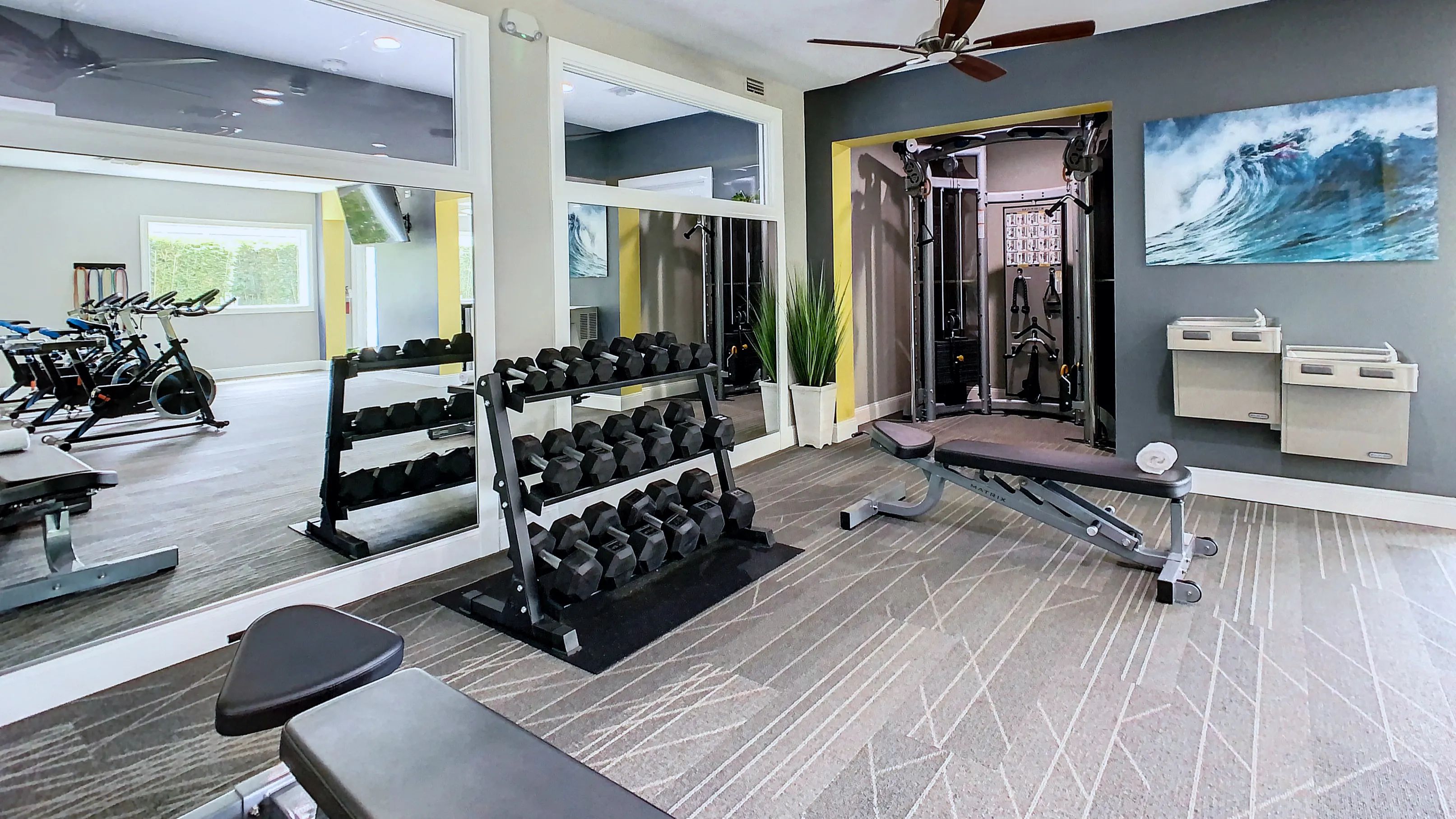 Our resident fitness center boasts an array of free weights for a complete workout. 