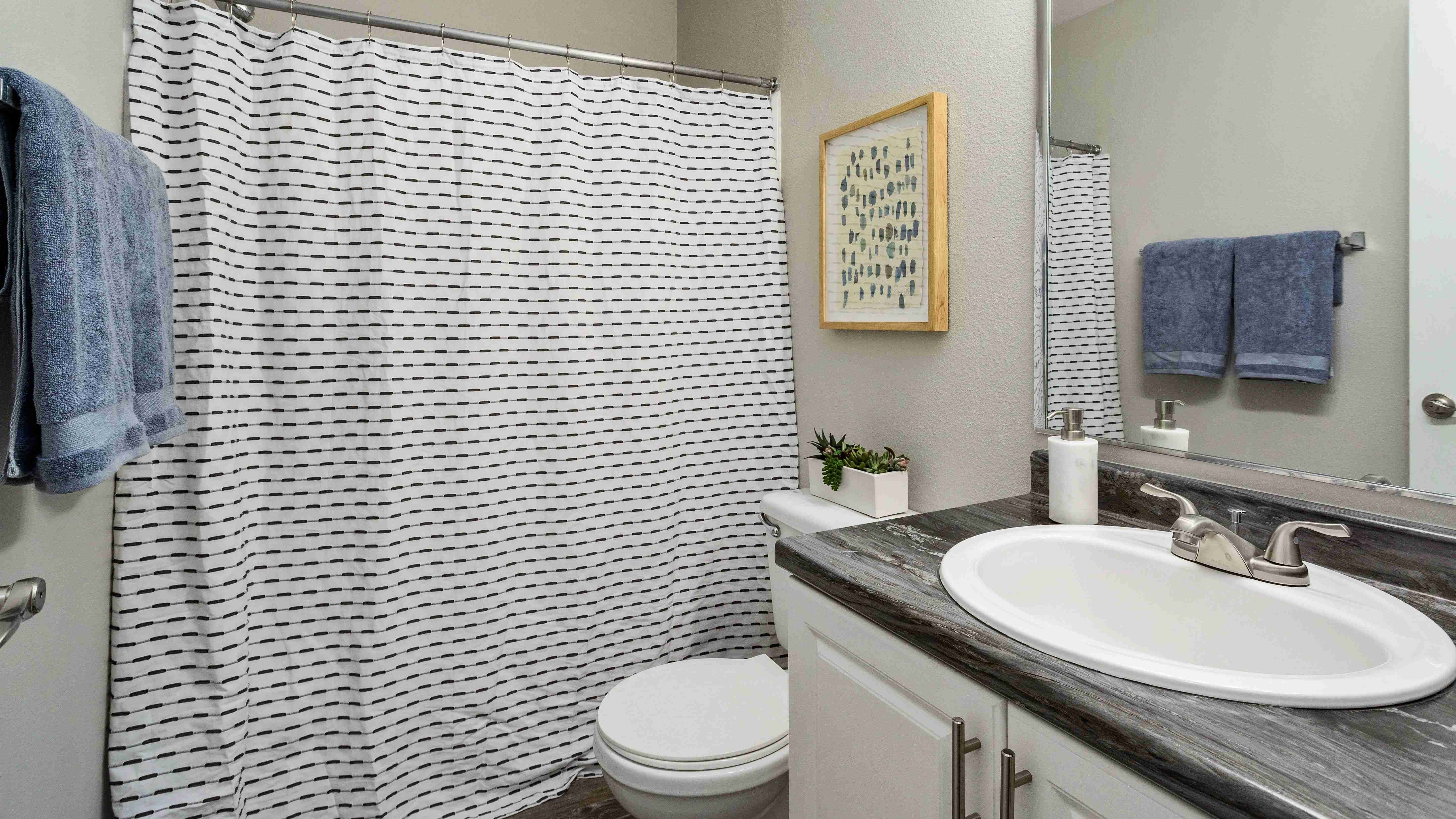 Rediscover daily rituals in generous bathrooms where ample countertops and large mirrors offer a space to redefine your self-care. 
