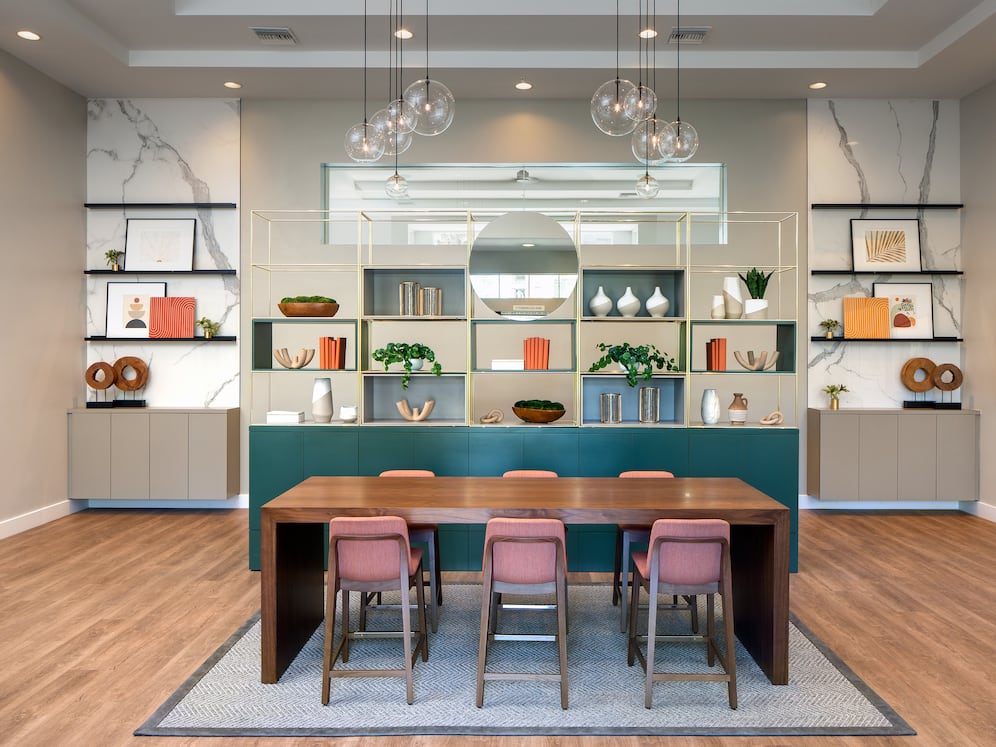 Resident lounge with entertaining kitchen, dining area, and lounge seating