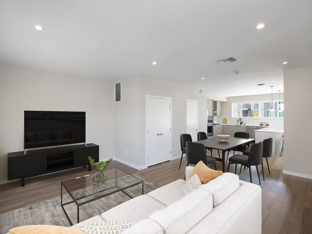 Signature Collection I 4-Bedroom Townhome Living and dining areas with hard-surface vinyl plank flooring throughout