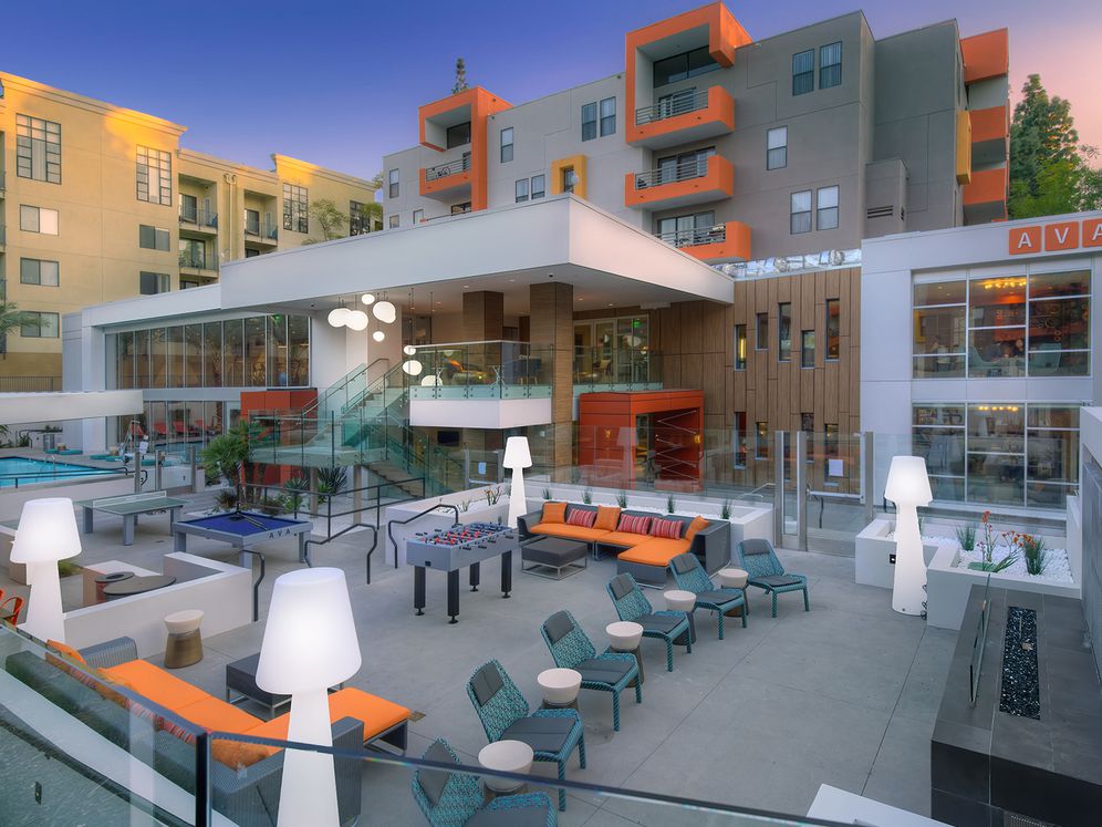 Outdoor Lounge with Seating Fire Pit and Game Tables