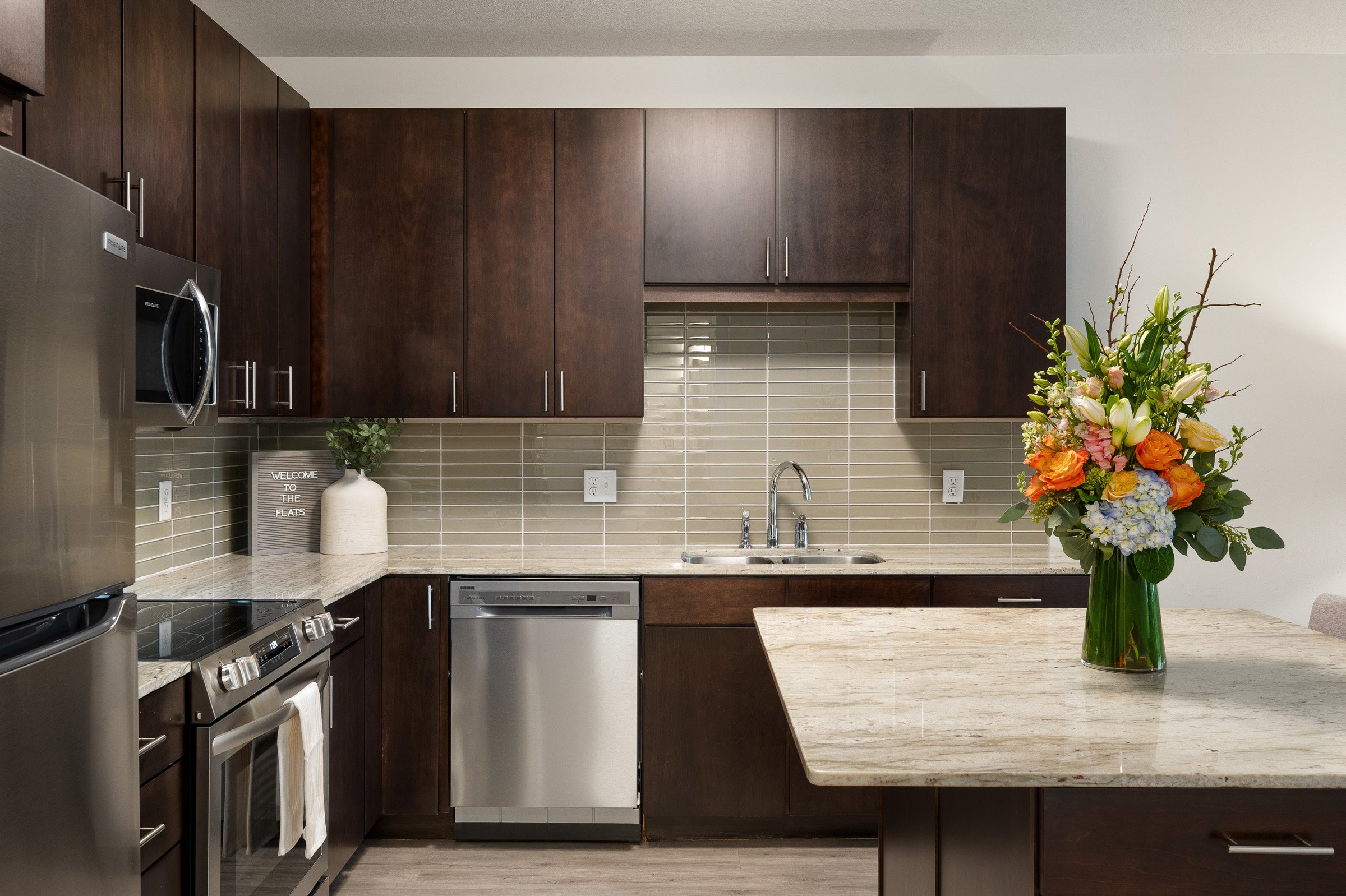 Kitchen with Granite Countertops & Tiled Backsplash