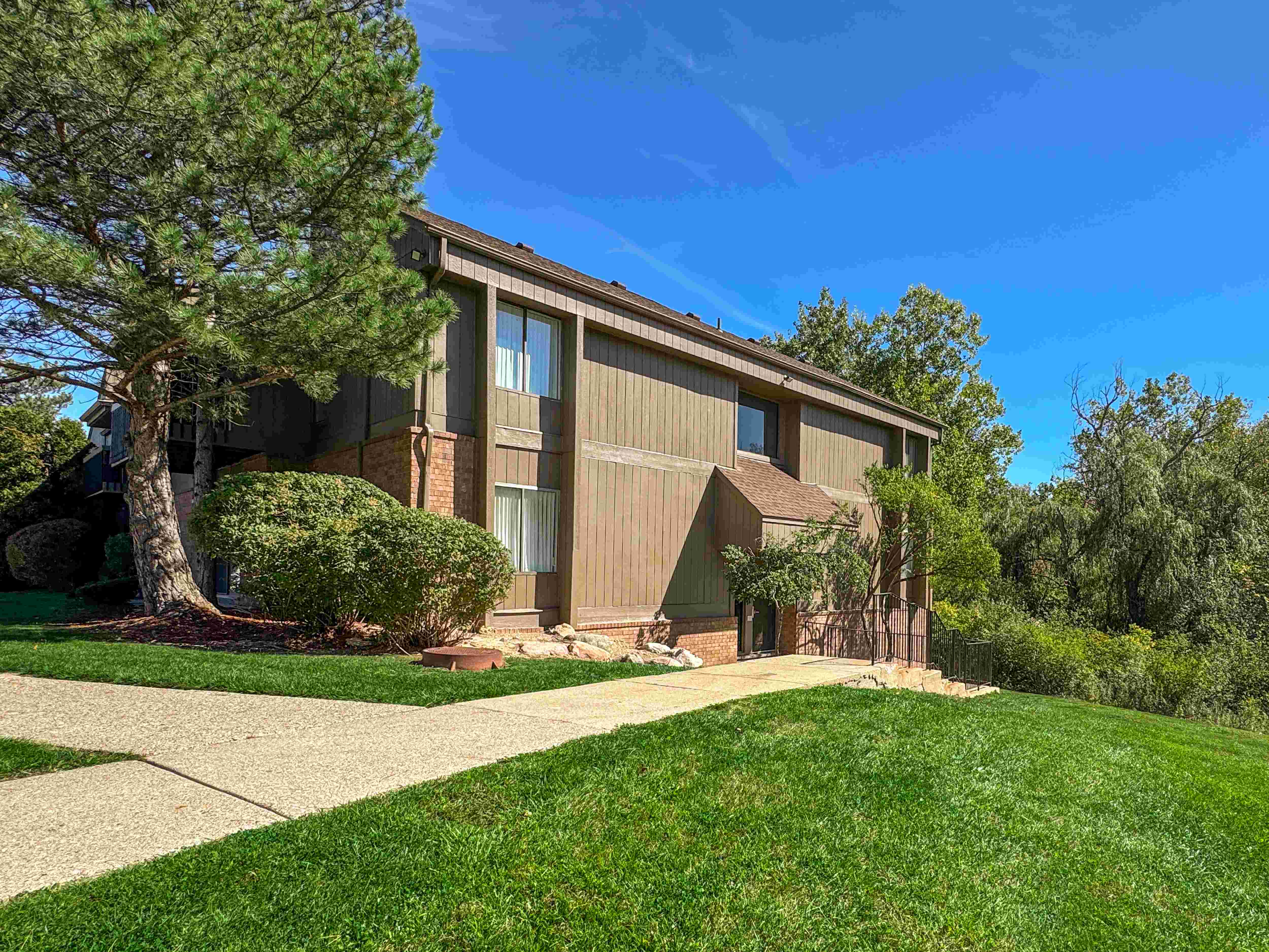 Expansive Green Space Apartment Building Exterior at Franklin River Apartments, Southfield, MI