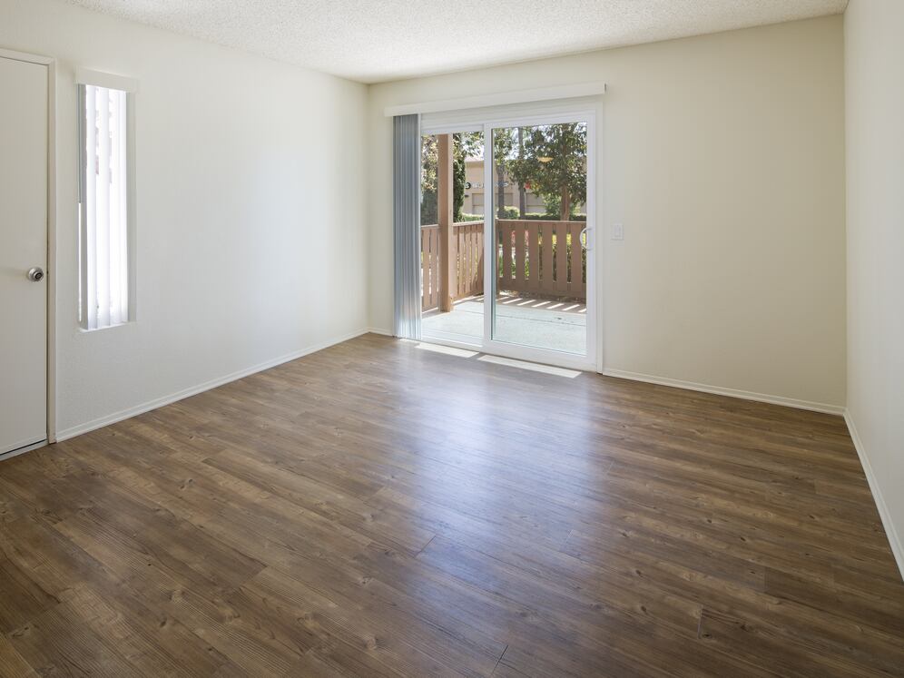 Renovated Package I living room with hard-surface flooring