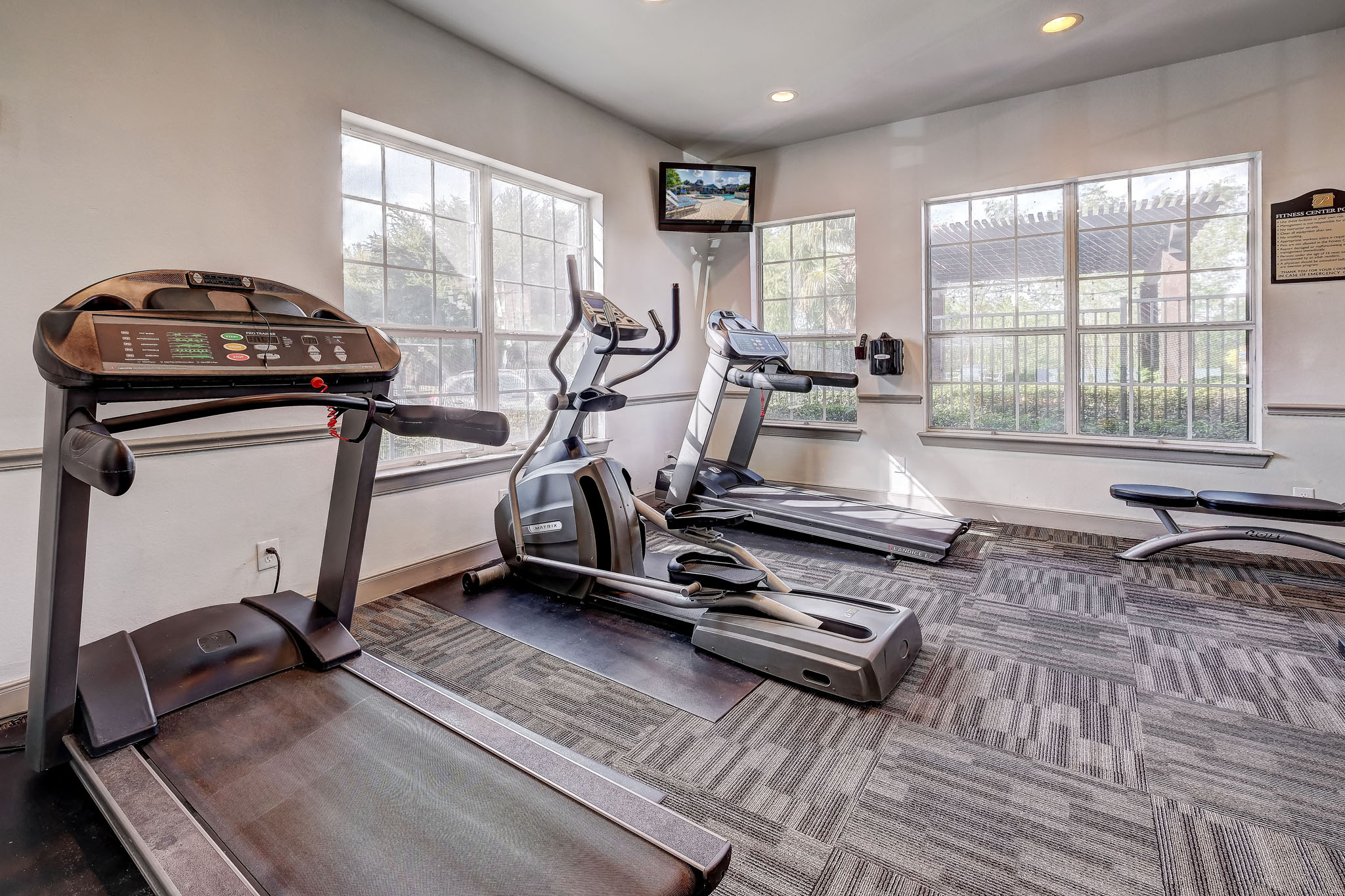 Fitness Center with treadmills and weight machines