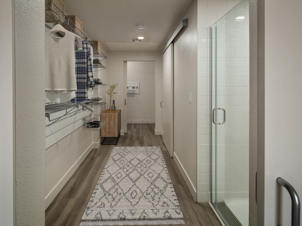 Finish Package I walk-through bath with standing shower and closet with gear wall
