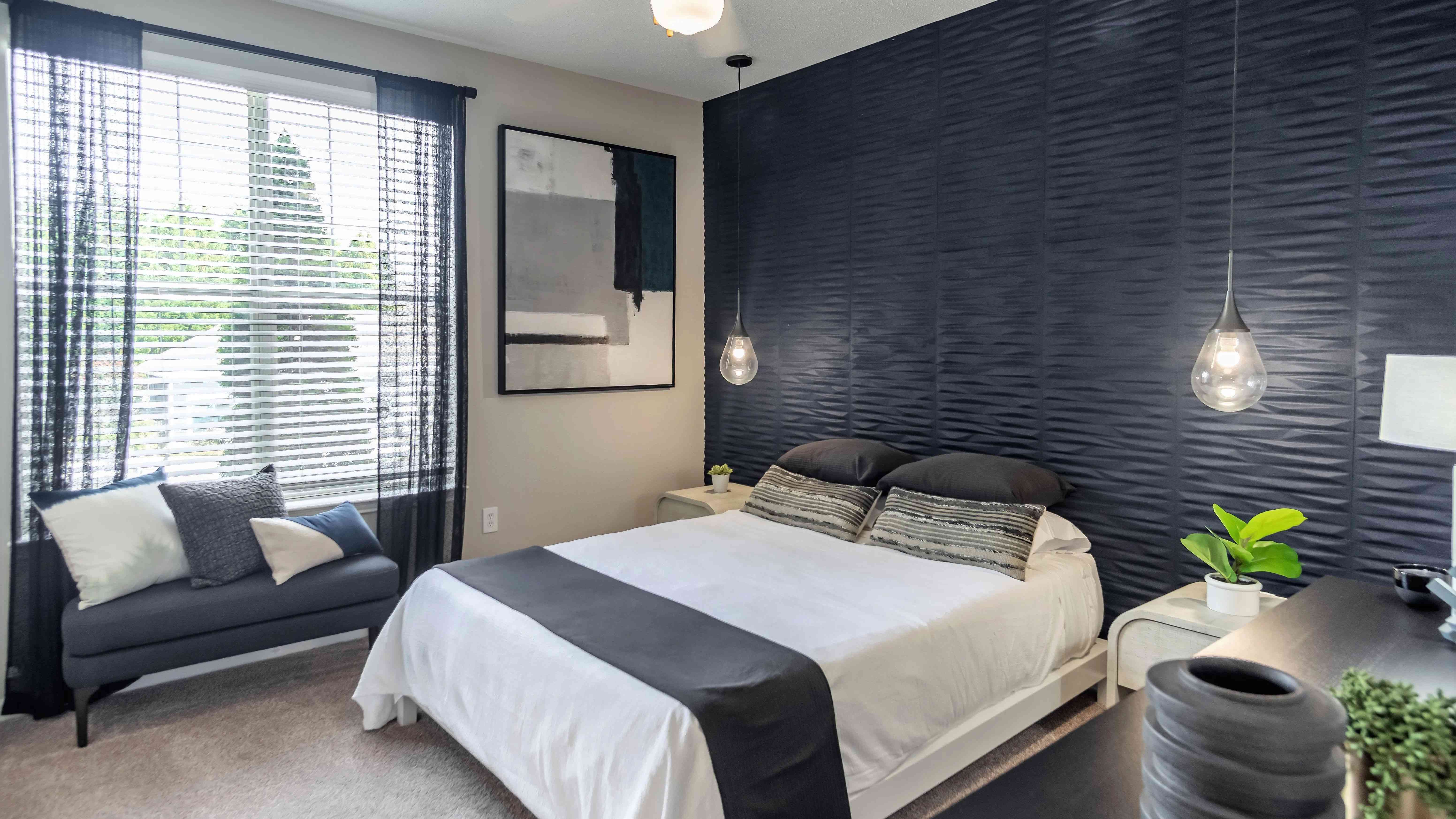 Discover blissful tranquility in our expansive bedroom oasis, complete with sunlit views and multi-speed ceiling fans.