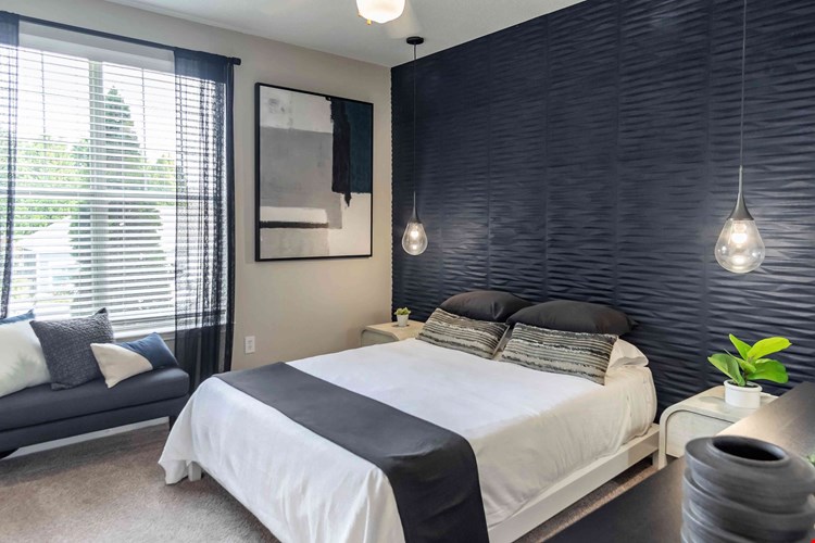 Discover blissful tranquility in our expansive bedroom oasis, complete with sunlit views and multi-speed ceiling fans.