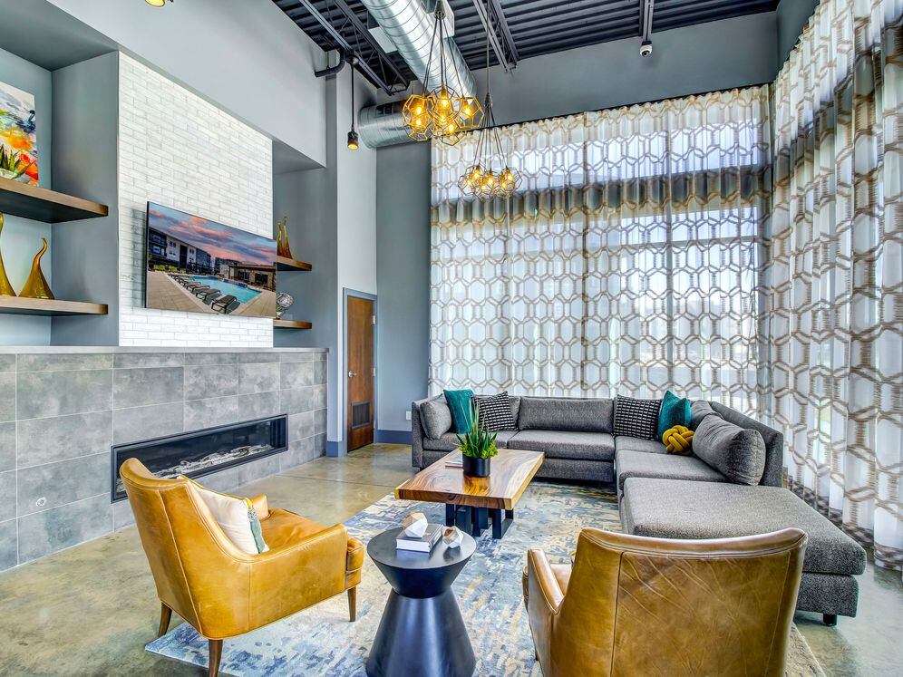 Resident's clubhouse with entertaining kitchenette, flat-screen television, billiards, and more