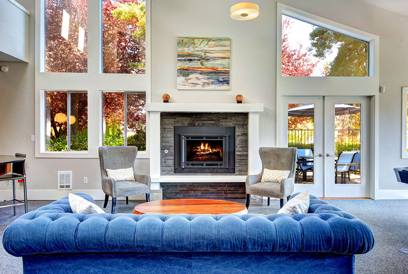 The Reserve at Bucklin Hill clubhouse with sofa and fireplace