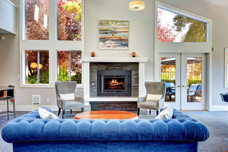 The Reserve at Bucklin Hill clubhouse with sofa and fireplace