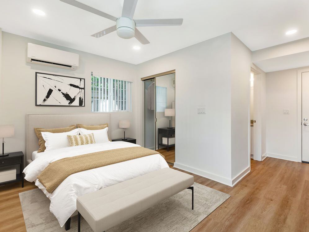 Renovated Package II living and sleeping area with hard surface flooring