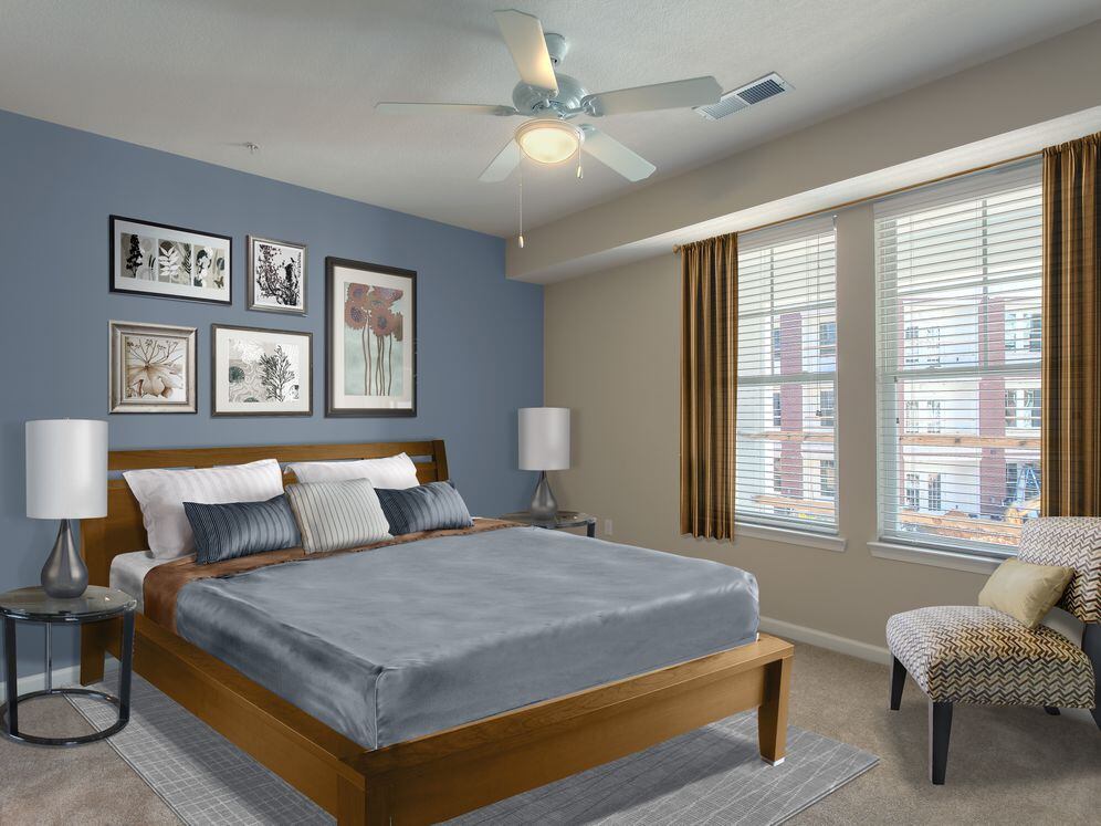 Bedroom with carpet and accent wall