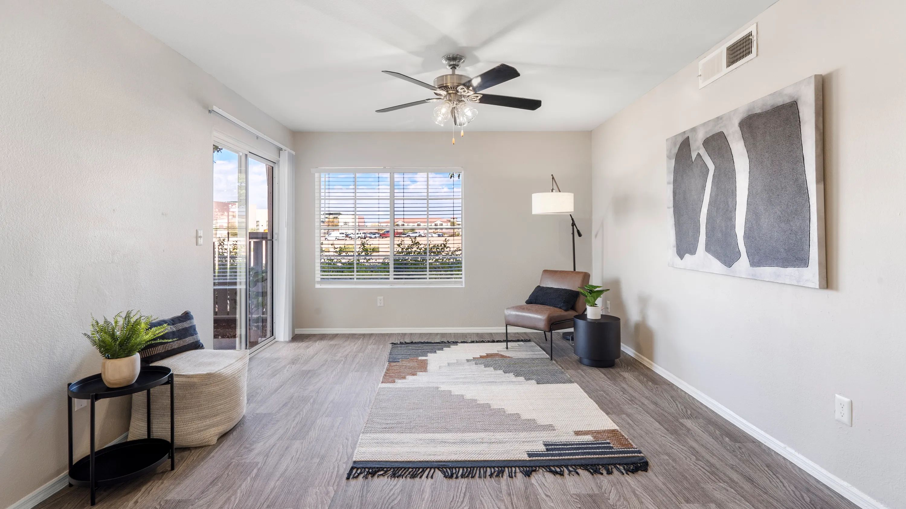 Pleasure in refined wood-style floors, sliding doors leading to your private patio, large windows, and a ceiling fan gracing our spacious living rooms. 