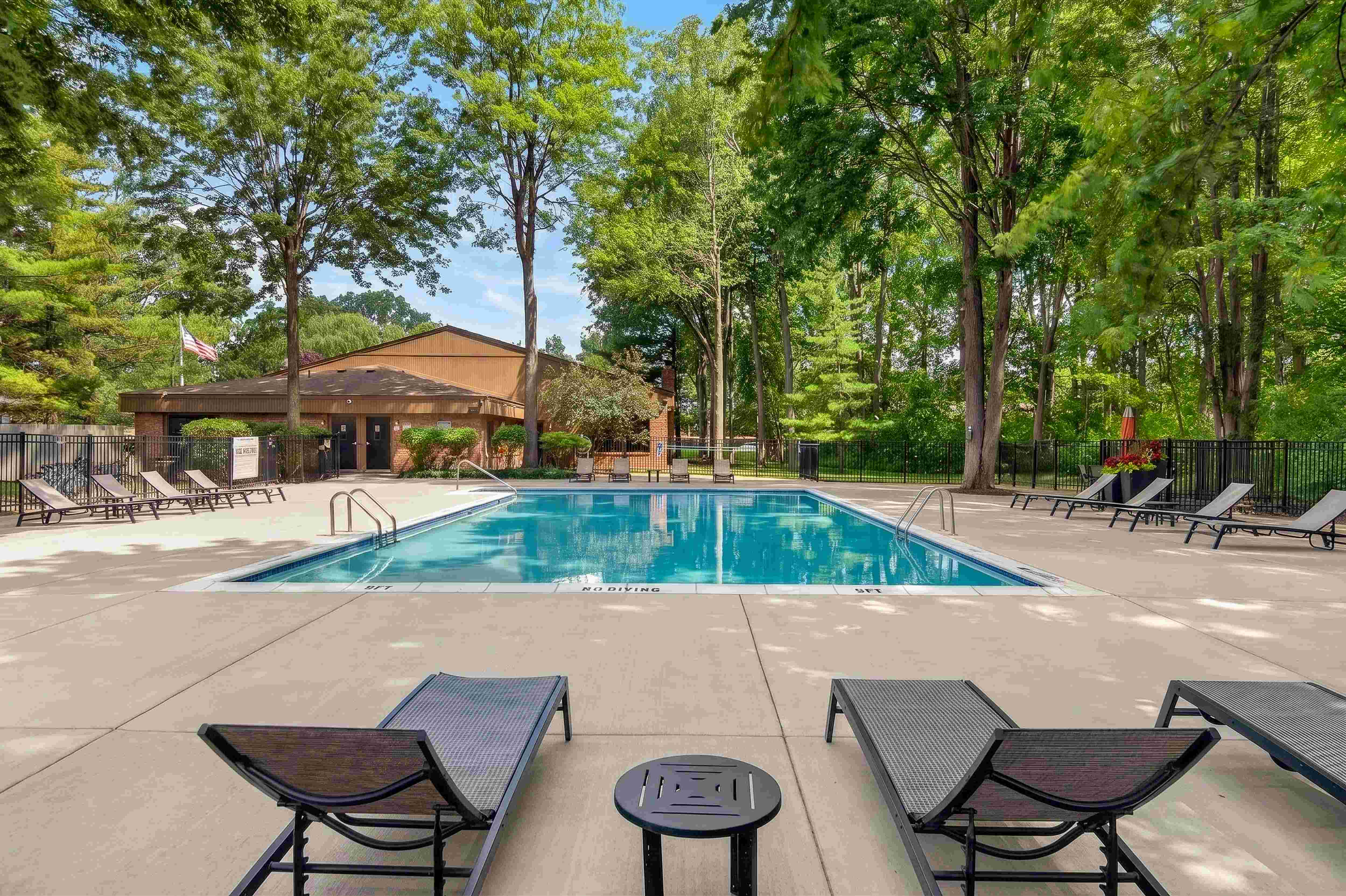 Heated swimming pool with sundeck at Eastwood Village Apartments in Clinton Township, MI.
