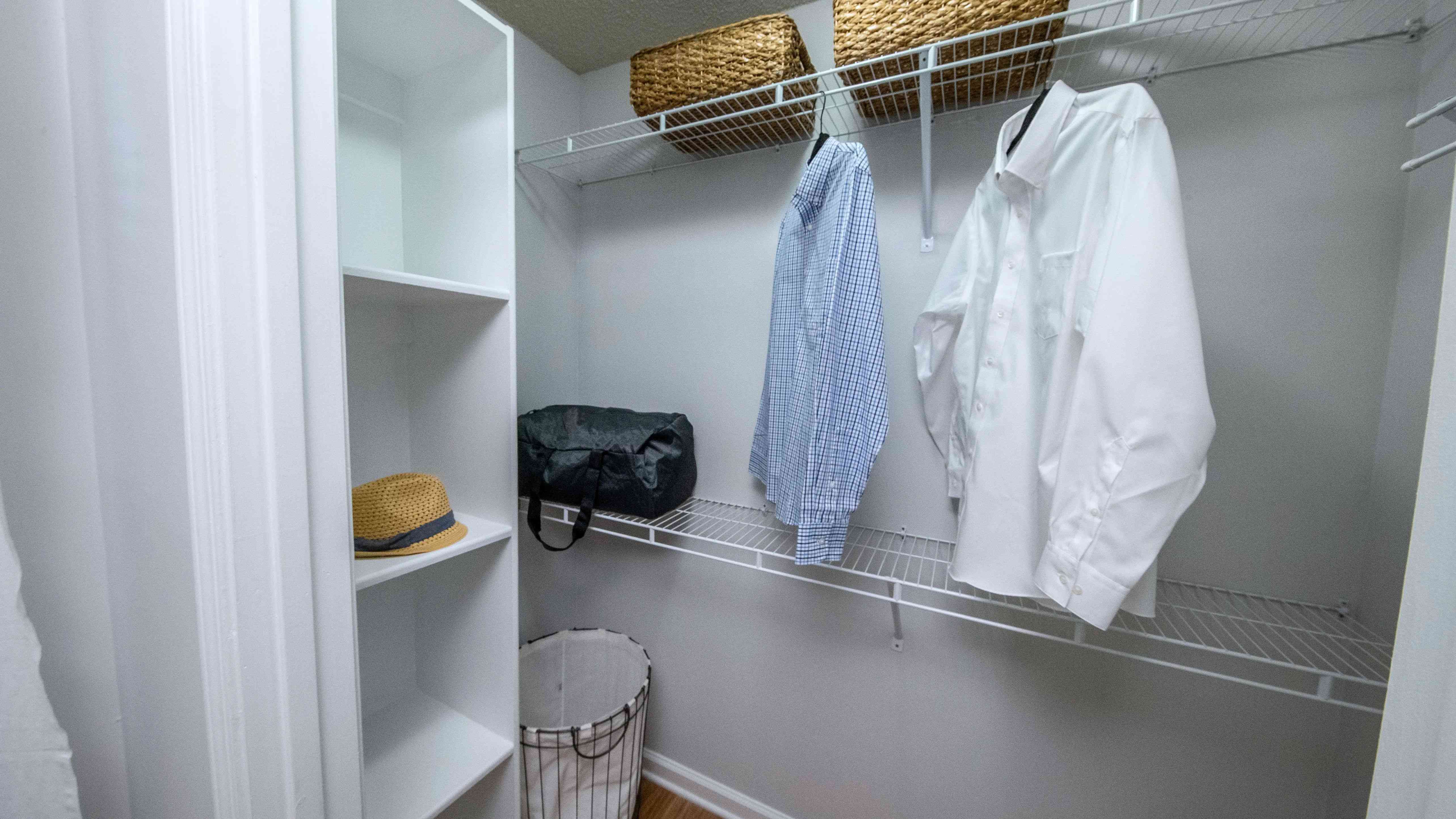 Our walk-in closets feature staggered shelving for multiple levels of hanging and storage, along with a floor-to-ceiling shoe rack for the perfect organization.